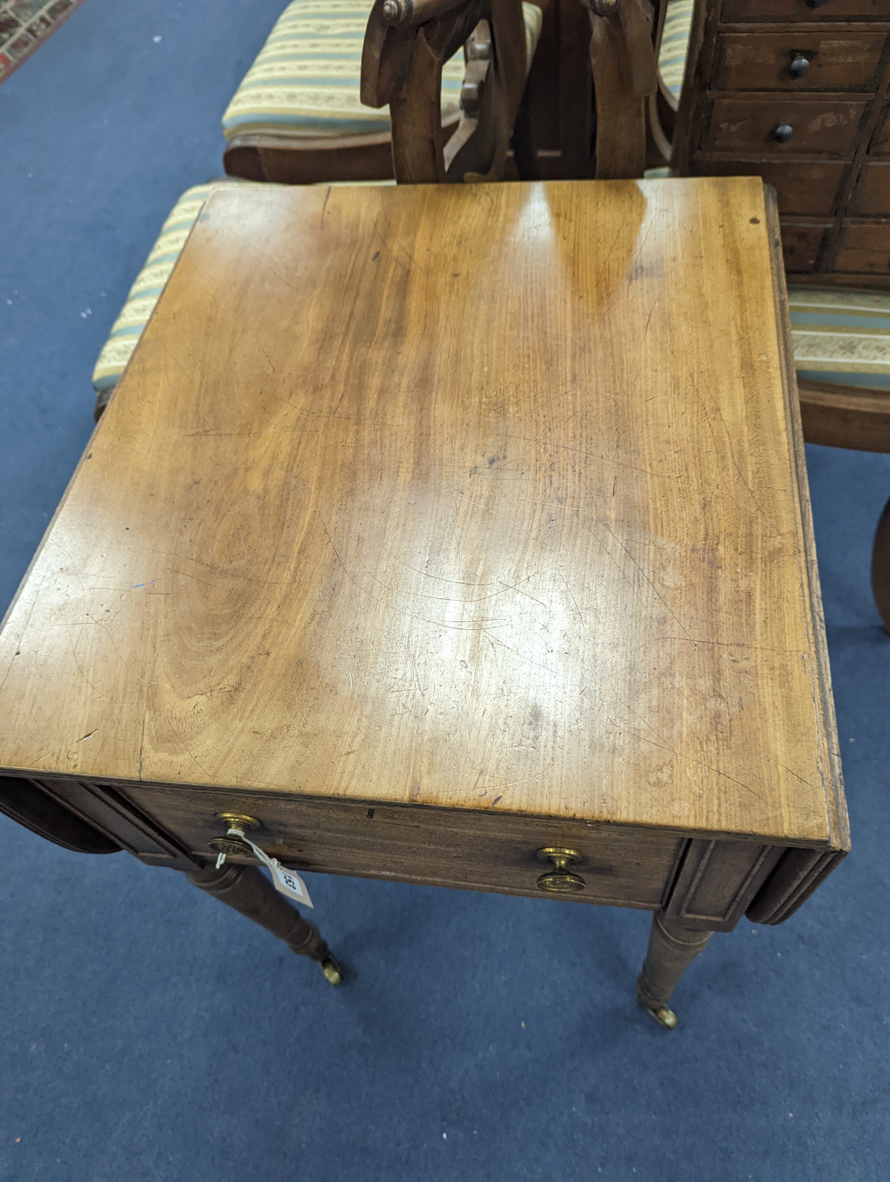 A Regency mahogany drop flap work table with twin fall compartments, width 48cm, depth 54cm, height 71cm